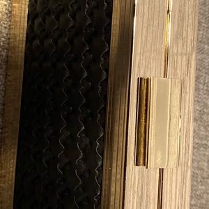 Black and gold clutch bag. It can goes with anything has a little gold chain